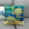 Linen square pillow cover with watercolor turtle print on a gray fabric sofa - Beach Double Turtle Watercolor (10)