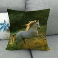 Linen cushion cover featuring a white horse running pattern on a grey fabric sofa - White Horse Forest Green(16)