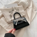 Black mini flap handbag with crystal rhinestone bow and silver chain strap for women - Black