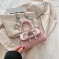 Pink crossbody square bag featuring a silver rhinestone bow and delicate chain strap - Pink