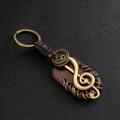 Porte-clés clé de sol rétro en cuir bronze avec sangle tressée et détails métalliques - Note de musique