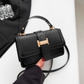 Elegant black crocodile texture handbag with golden H-clasp and adjustable shoulder strap - Black
