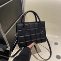 Black checkered square handbag with golden hardware and adjustable crossbody strap - Black