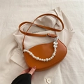 Brown leather half-moon shoulder bag featuring pearl and silver heart chain strap - Brown