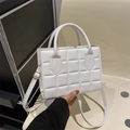Quilted white crossbody bag with square embossed texture and adjustable shoulder strap - White