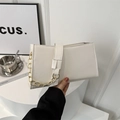 Modern white PU leather shoulder bag featuring a sleek gold chain and minimalist design - White
