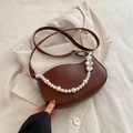 Dark brown crescent shoulder bag with elegant pearl chain and silver heart charms - Brown