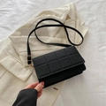 Minimalist black quilted crossbody bag in felt texture with gold metal hardware - Black