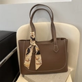 Brown leather tote bag with white stitching and vintage floral silk scarf on handle - Dark Brown