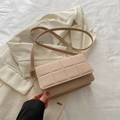 Minimalist beige quilted crossbody bag with waffle texture and slender strap - Khaki