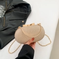 Elegante borsa da sera ovale dorata con trama intrecciata e chiusura a fiocco in metallo - Oro