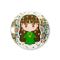 Close-up of circular tinplate badge with cartoon girl illustration and floral patterns - Girl in Green Dress Style (Single Item 6)