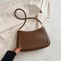 Brown half-moon shoulder bag in textured synthetic leather with golden metal hardware - Brown