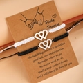 Pulseras de la amistad tejidas a mano con corazones entrelazados en tarjeta de regalo - Negro & Blanco