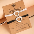 Handmade woven couple bracelets with hollow heart charms on a Soulmate display card - Hollow Heart Set