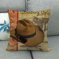 Detail of Cowboy Up linen pillowcase with western hat and saddle art on a sofa - Brown Cowboy Hat Wood Grain Style (11)