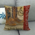 Detail of vintage cowboy boots and paisley print on linen pillowcase over sofa - Realistic Cowboy Boots Style (13)