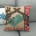 Detail of vintage western denim pillow cover with revolvers on a soft grey sofa - Fringe Gloves & Pistols Style (5)