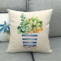 Funda de cojín de lino con estampado de suculentas en acuarela sobre un sofá gris suave - Patrón de Maceta a Rayas Azules y Blancas con Suculenta (15)