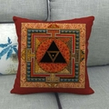 Detail of red linen cushion cover featuring intricate geometric patterns on a grey sofa - Dark Red Mystery Geometric Pattern (5)