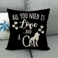 Detail of black linen pillowcase featuring white cat silhouette and cat paw prints - All You Need Is Love And A Cat(5)