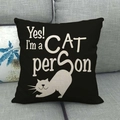 Linen cushion cover with black cat print and 'Yes! I'm a CAT person' text on a gray sofa - Yes! I'm A Cat Person(9)