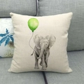 Detail of linen pillowcase with hand-drawn elephant and balloon on grey sofa - Elephant with Green Balloon (10)