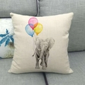 Detail of linen pillowcase featuring elephant and balloons on grey fabric sofa - Baby Elephant with Tricolor Balloons (5)