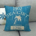Close-up of a blue linen pillow cover with vintage yellow Sea Girt palm tree print - Sea Girt Retro Coconut Tree Style (3)