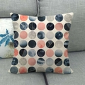Detail of linen throw pillow with marble geometric circular patterns on a sofa - Blue Pink Circular Geometric Style