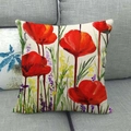 Funda de cojín de lino con diseño floral de acuarela roja en un sofá gris - Estilo Amapola Acuarela (3)