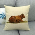 Macro detail of the rustic cotton linen cushion cover featuring a vintage bull oil painting - Lying Brown Bull Pattern