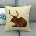Detailed close-up of colorful bull oil painting on a square linen cushion cover - Side-lying Longhorn Bull Pattern