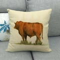Detail of linen cushion cover featuring realistic brown bull oil painting on gray sofa - Standing Brown Bull Pattern