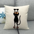 Close-up of a minimalist linen pillowcase featuring a cartoon black cat with orange eyes - Climbing And Grabbing Black Cat (10)