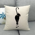 Detailed view of linen cushion cover showing a minimalist black cat print on sofa - Cat Back View With Paw Prints (13)