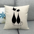 Detailed texture of linen pillowcase featuring minimalist black cat silhouette on a gray sofa - Two Cats Side By Side With Curved Tails (16)