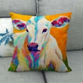 Artistic cow oil painting cushion cover shown on a grey sofa with woven linen texture - Orange Purple Green Art Bull Portrait (2)