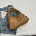 Quilted caramel puffer tote bag with diamond stitching shown in a flat lay style - Khaki