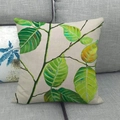 Linen cushion cover with green tropical leaf watercolor print on a gray fabric sofa - Bright Fresh Green Leaf Branch Simple Style (12) / 45x45cm