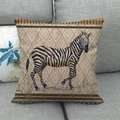 Detail of linen pillow cover featuring a zebra print and ethnic geometric borders - 45x45cm