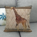 Retro linen pillowcase with giraffe print and geometric African tribal patterns on a sofa - 45x45cm