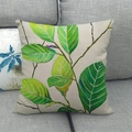 Linen pillowcase with tropical green leaf watercolor print on a gray fabric sofa - Hand-painted Light Dark Transition Green Broadleaf Style (13) / 45x45cm