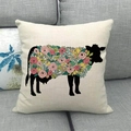 Detail of floral cow silhouette print on beige linen pillow cover on a sofa - Square / Cow Floral Off-white Background (5)