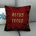 Detail of red Halloween pillow cover with golden Hocus Pocus text and spooky silhouettes - Red Black Gold Hocus Pocus