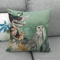 Close-up of linen pillowcase with owl and floral oil painting on grey sofa - Owl and Floral (1)