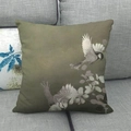 Close-up of linen-style pillow with floral bird print on grey fabric sofa - 18x18 Inch / Floral and Bird Green Background (10)