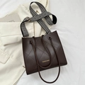 Quilted dark brown tote bag with large diamond stitching and houndstooth strap - Brown