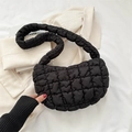 Minimalist black quilted puffer cloud bag with soft textured padding and wide shoulder strap - Black