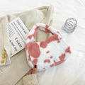 Pink and white cow print faux fur handbag with a soft plush texture and matching handle - Cow Print-Pink